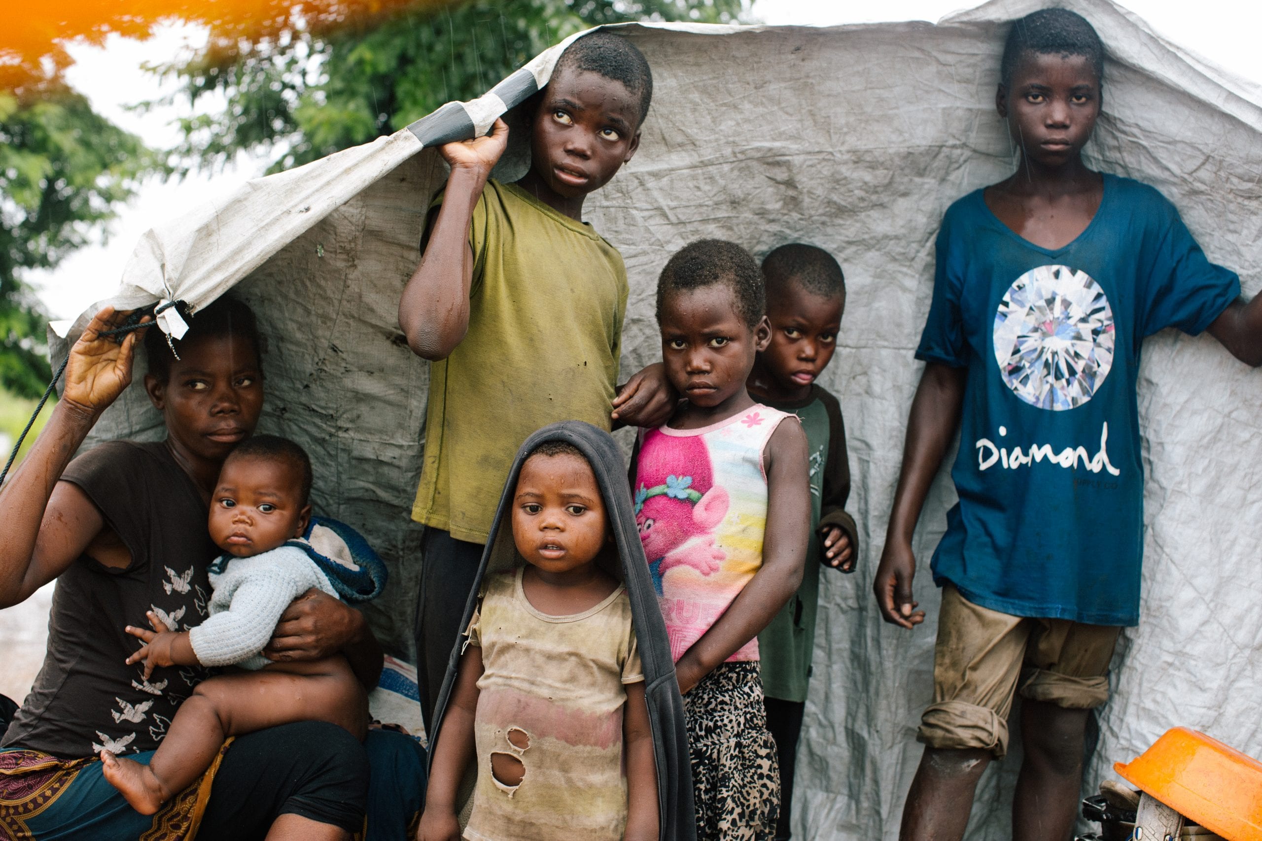 A family sheltering by the road