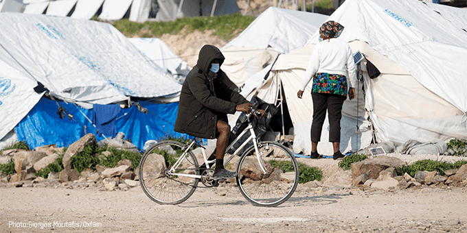 Person on bike outside refugee camp