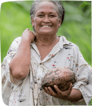 Woman while holding a coconut