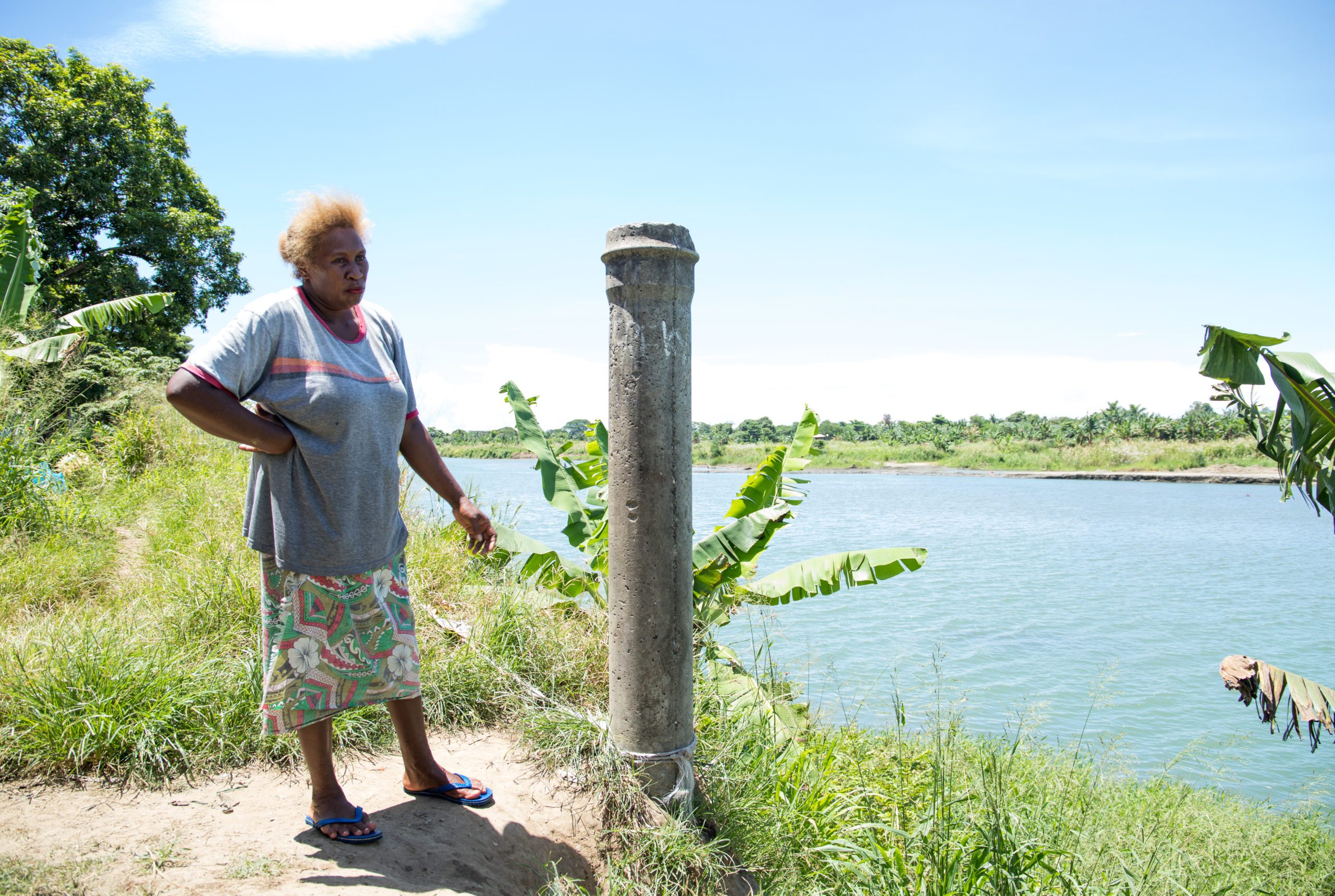 Woman standing in what remains left of her home
