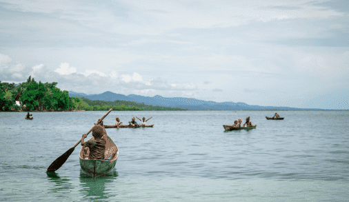 kid paddling in canoe