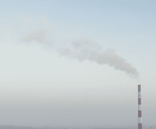 Image of a factory with smoke