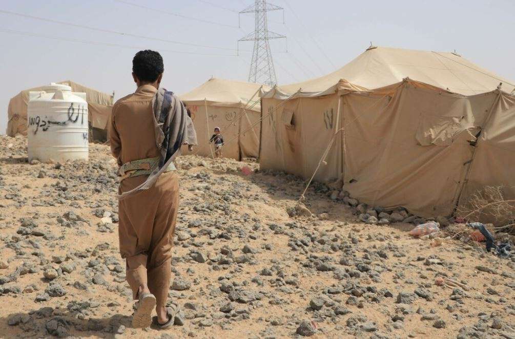 A man walks away from the camera