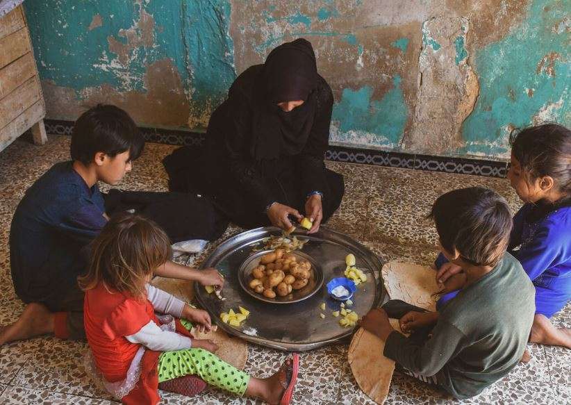 A family sit together to eat