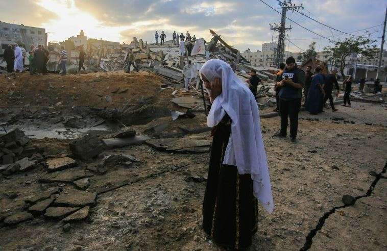 A woman in Gaza stands near a street