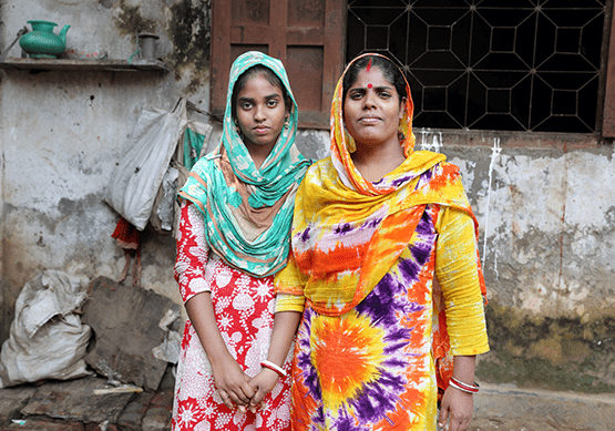 Two women stand together