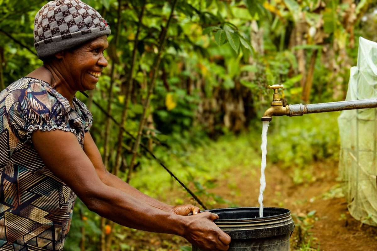 Woman washes hand with new installed water tap
