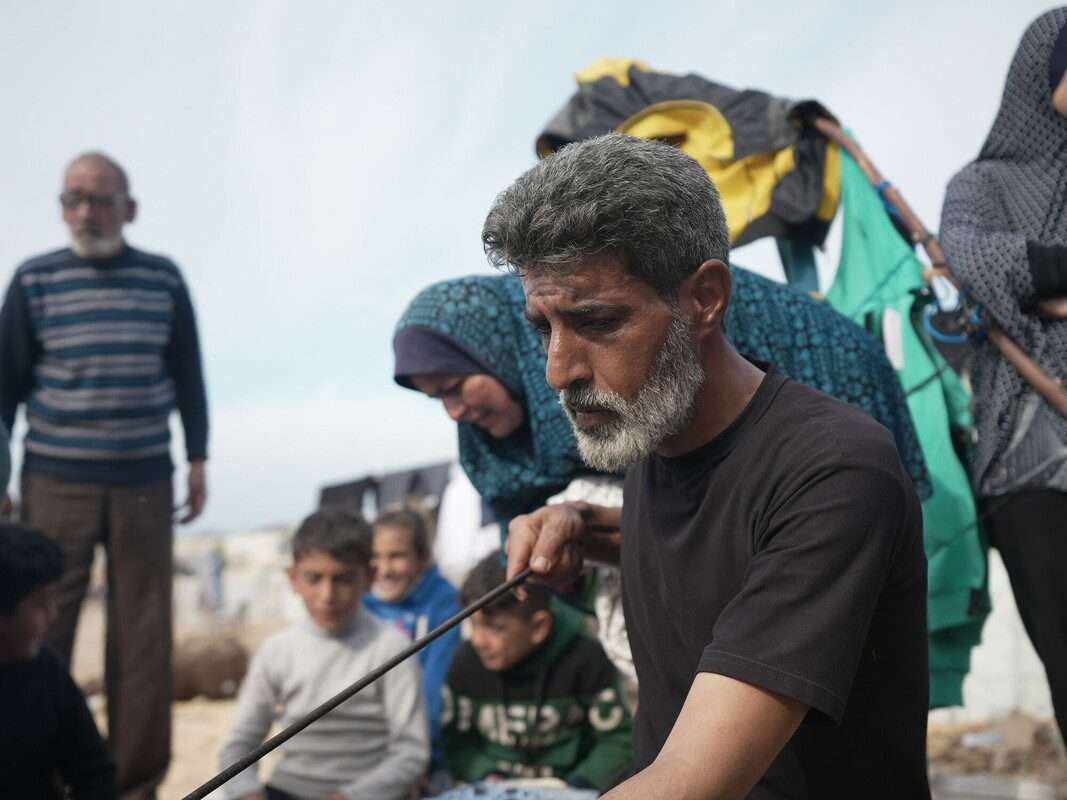 man making bread with oven oven made of clay