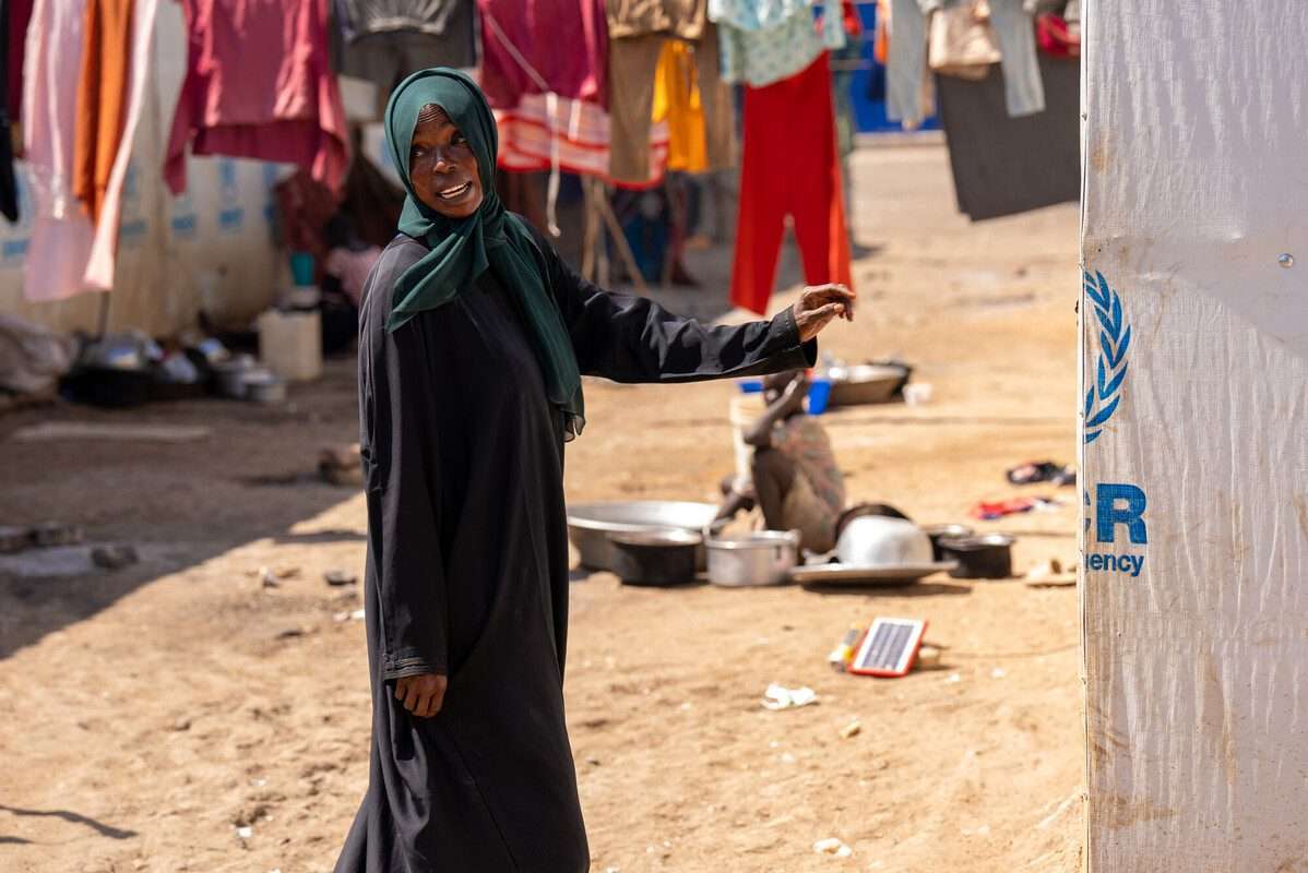 35-year-old Nadia Zahad, a refugee from the Sudan war stands outside her makeshift home in Renk, South Sudan - Credit - Herison Philip Osfaldo / Oxfam