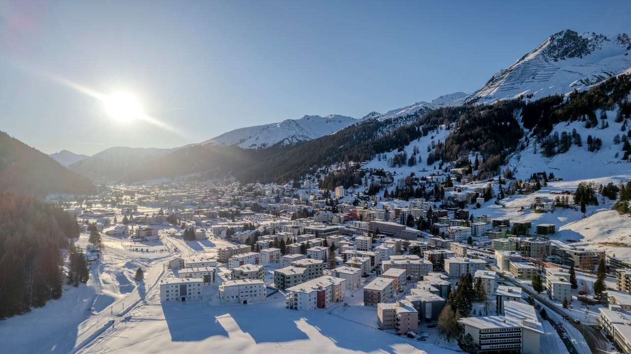 drone shot of city of DAVOS in snow