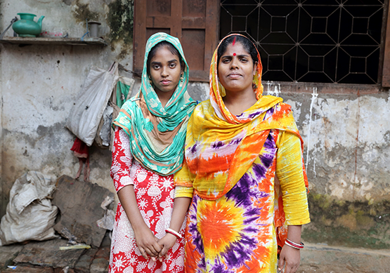 Two women stand together