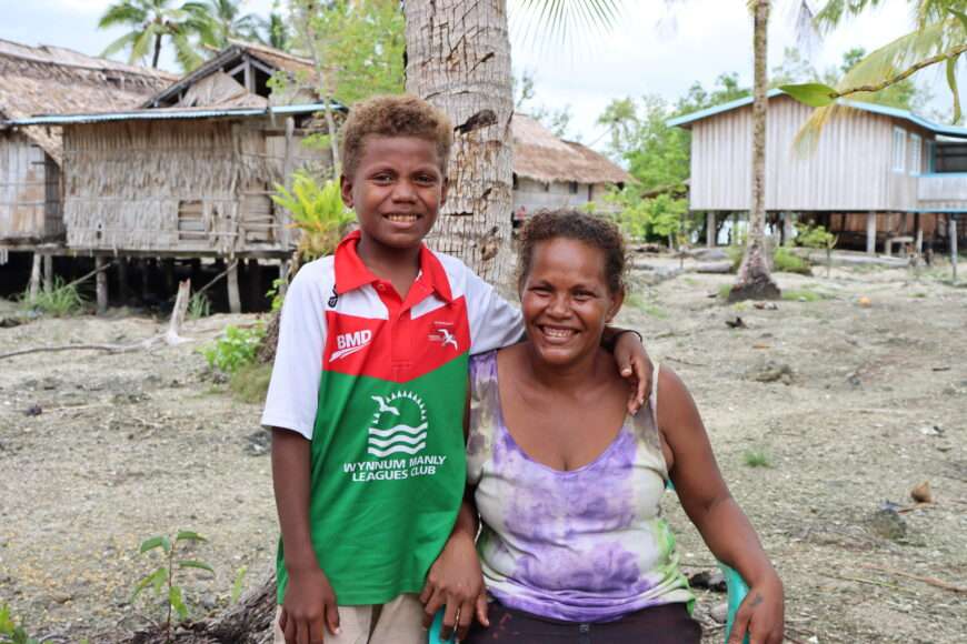 Mother and son smiling in the Solomon Islands