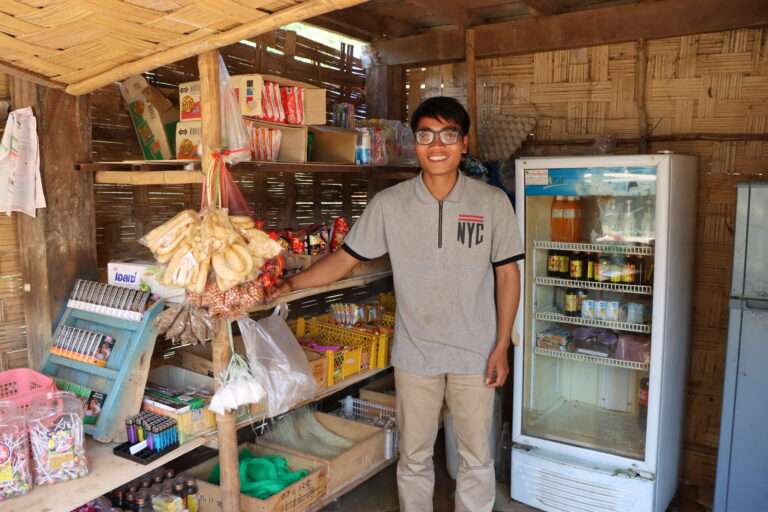 Chansouk smiling standing in his shop