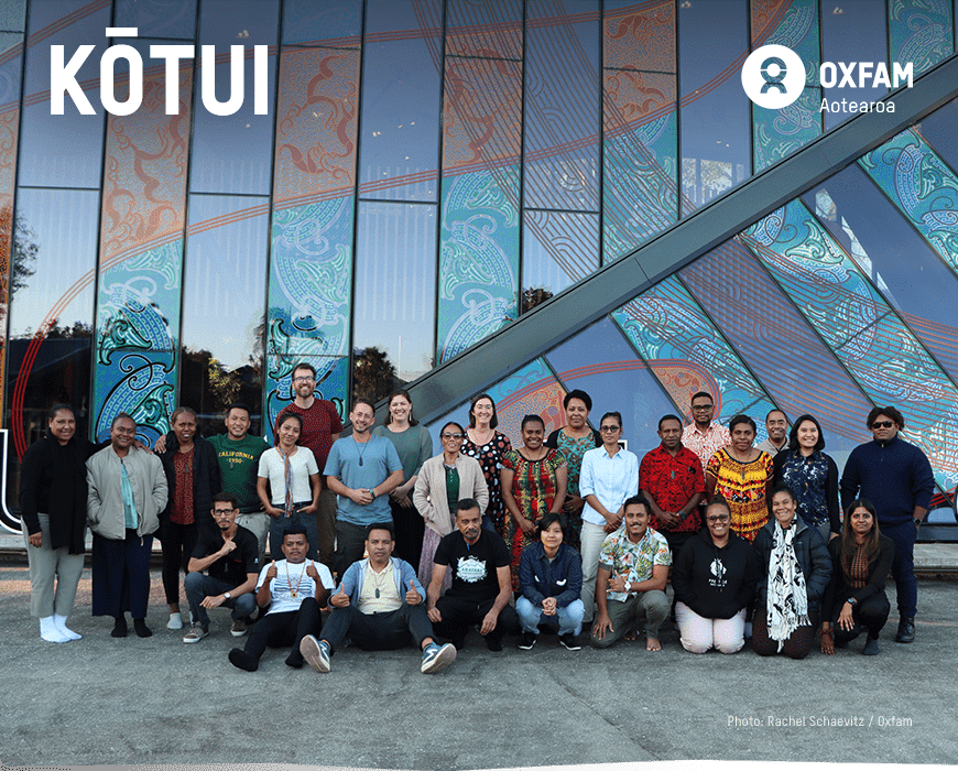 Banner with Kōtui staff gathered in Auckland at Te Kete event